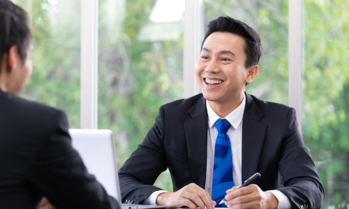 Man in suit smiling