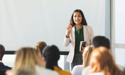 University Lecturer talking with students